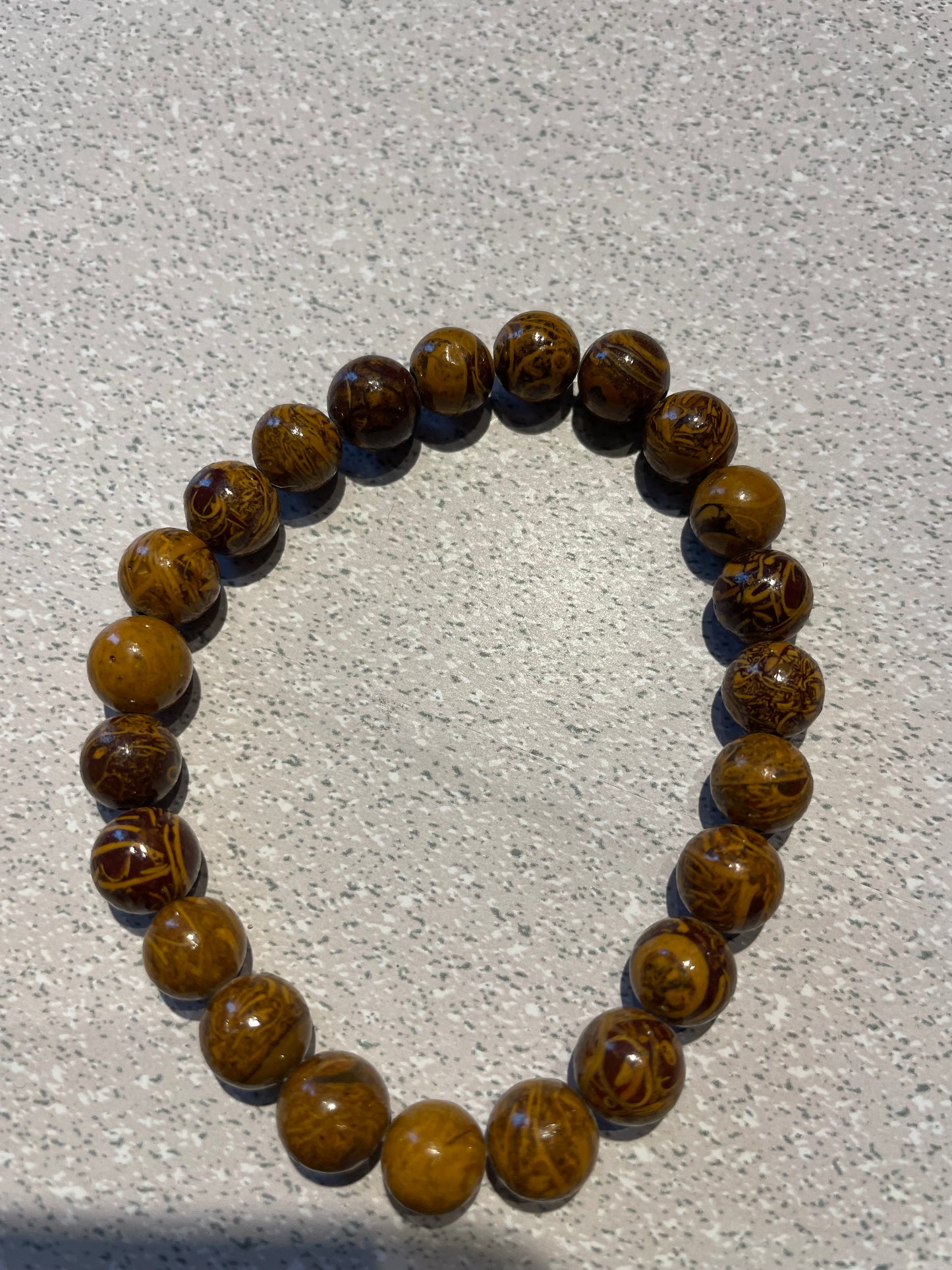 Bracelet en bois pétrifié (billes 8mm)